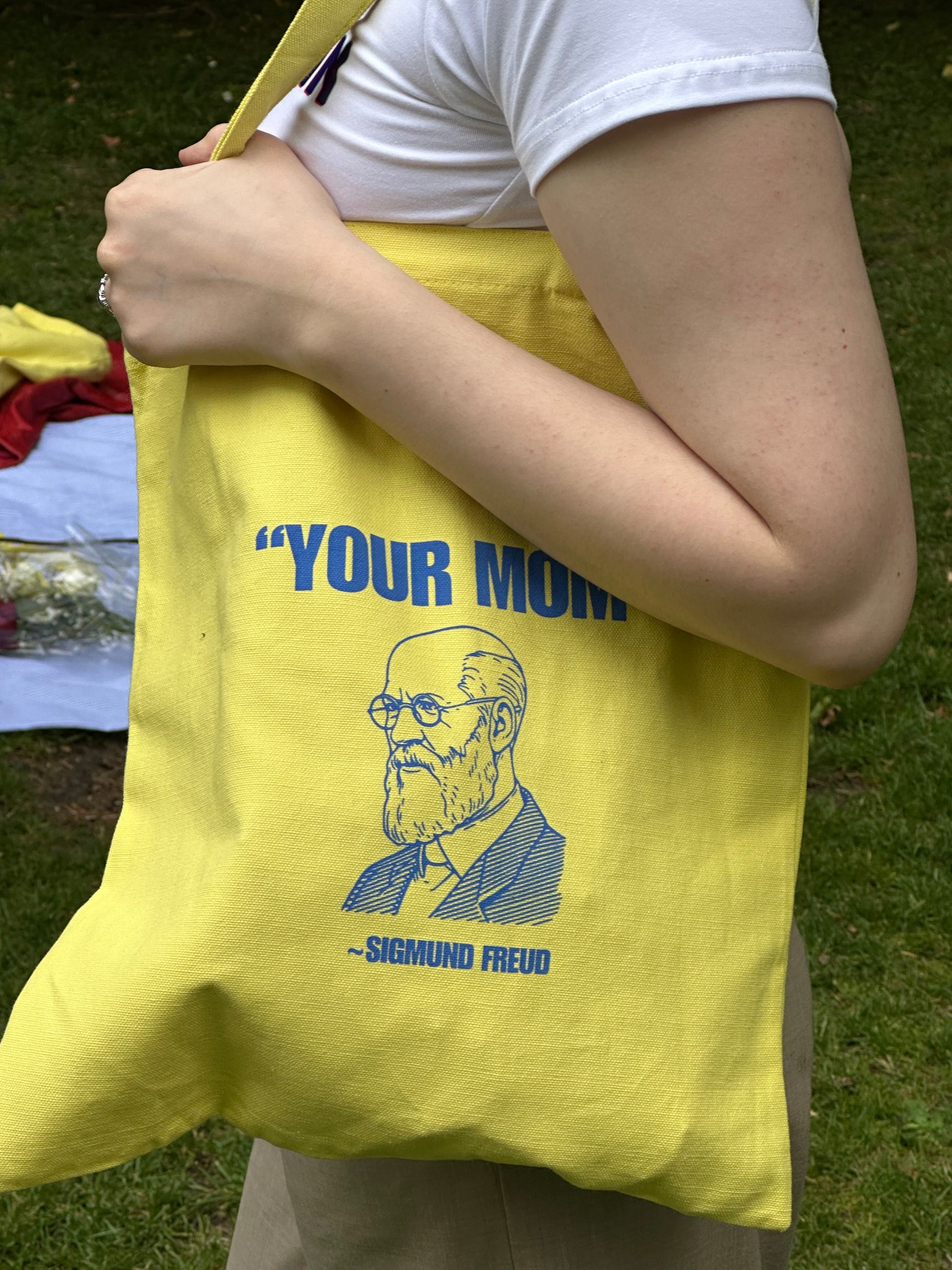 Close-up of Freud quote print on yellow canvas tote