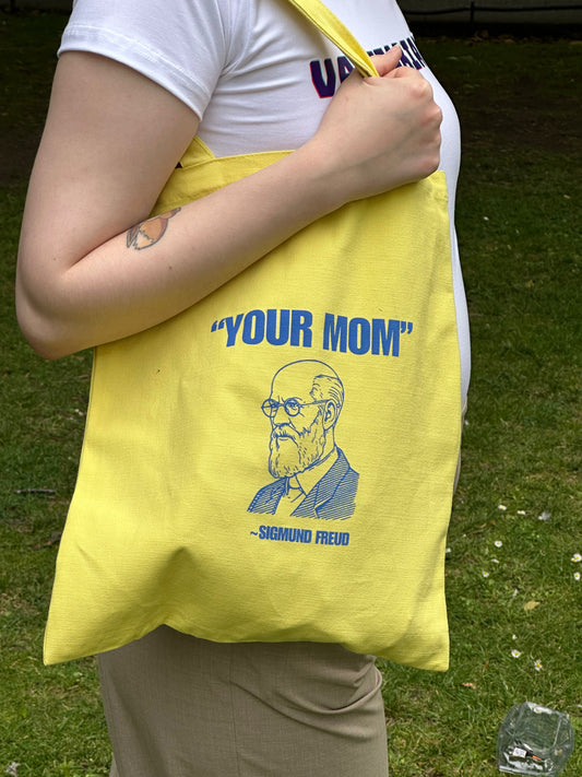 Yellow tote bag with blue Sigmund Freud sketch and “YOUR MOM” text print